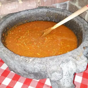 Salsa of the day in the giant Mexican stone salsa dish on display