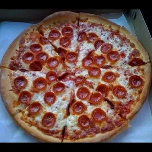 a pepperoni pizza in a box