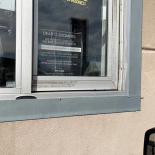 a sign in the window of a restaurant