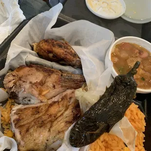 3 piece chicken,2 sides of choice and drink . Comes with tortillas and jalapeño.  I got rice Ana charro beans . Amazing stuff