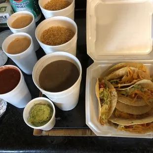 Tacos, beans, rice, queso etc.