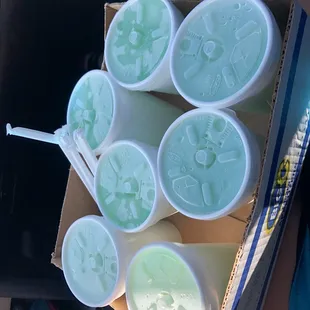 six cups of ice cream in a cardboard box