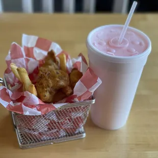 a basket of food and a drink
