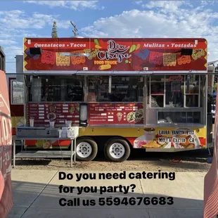 a food truck parked on the side of the road