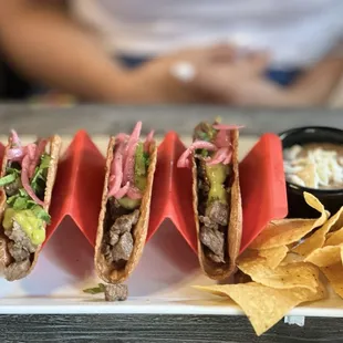 a plate of tacos and chips