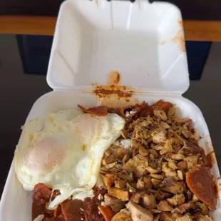 Chicken Mole Chiliquiles have chicken have pork with two runny eggs