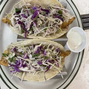 two fish tacos on a plate