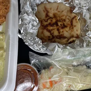 Items ordered Enchilada Suizas and Pupusas De Chicharron.