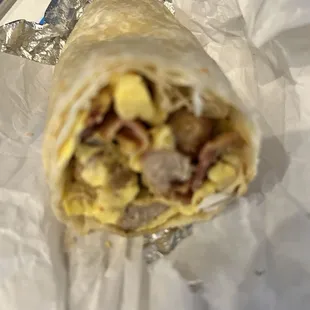 Sausage, bacon breakfast burrito.