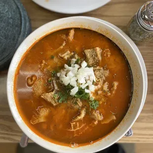 Menudo with onion and cilantro