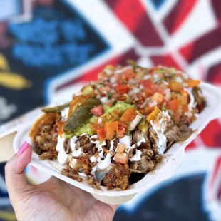 Super Baby Nachos w/ carnitas y lengua | $12.95