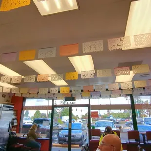 Colorful ceiling banner, window bar seating