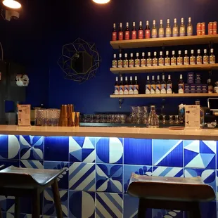 a bar with blue and white tiles