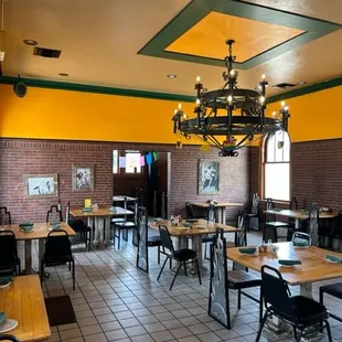 a dining room with tables and chairs