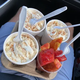 Corn in a cup and fruit cup.
