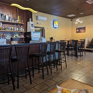 a view of a restaurant with a bar