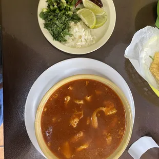 a bowl of soup and a plate of rice