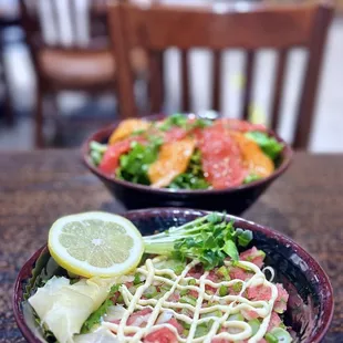two bowls of food on a table