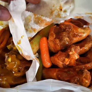 Good basic whole wings. Well cooked. Hot sauce on right was thin... Honey gold on left was nice and thick.  Both were tasty.