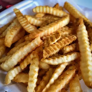 Relatively bland waffle fries despite dusting of seasoning. Perhaps dirty grease? Had an odd flavor/smell to them