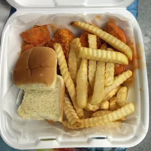 Regular Hot Chicken Tenders with Fries with a roll and blue cheese sauce.