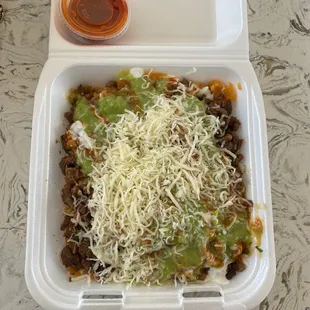 Burrito bowl de asada with extra spicy salsa on the side