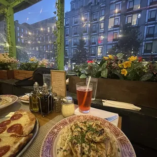 a plate of pasta and pizza