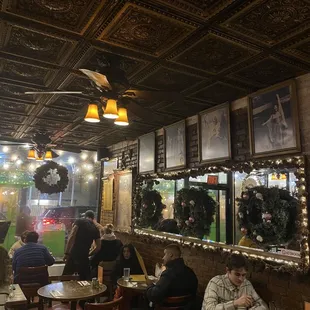 people sitting at tables in a restaurant