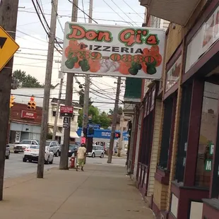 a sign for don g&apos;s pizzeria