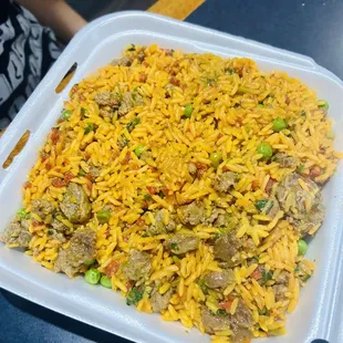 a plastic container filled with rice and meat