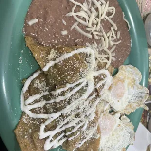 Omg these beans are refried and fresh !! Perfect eggs and slightly salted green salsa