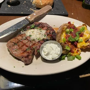 Ribeye with loaded baked potato