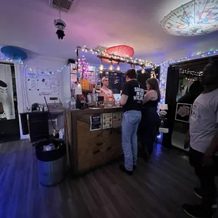 two people standing at the counter