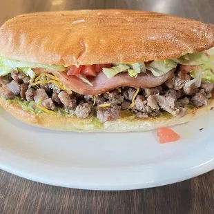 Torta Mexicana  Beefsteak ham ham lettuce tomato cheese and guacamole really good