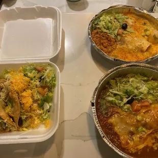 three takeout containers on a table