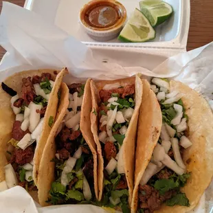 From left to right- tripa, steak, pastor, steak taco