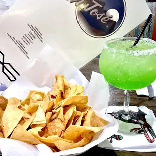 Chips with Melon Margarita on the rocks with salt. Yummm