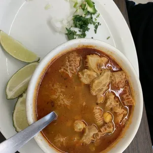 a bowl of soup with a spoon