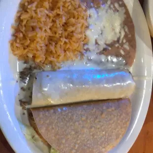 a plate of mexican food with rice and beans