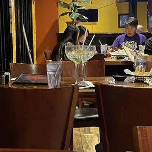 a couple of people sitting at a table