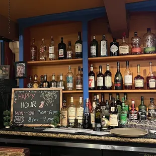 a bar with bottles of liquor