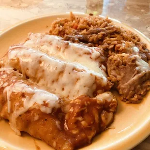 Chicken Enchiladas w/ rice &amp; beans.