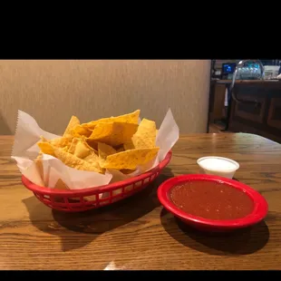 Chips and salsa with some spicy white stuff