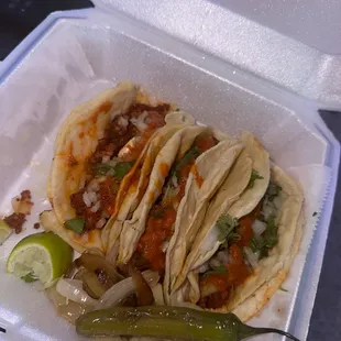 a taco in a styrofoam container