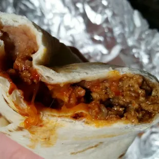 A look inside the Combination burrito with red chile!