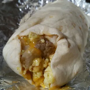 Steak, egg, green chile, and cheese breakfast burrito - with a request for potato added to it!