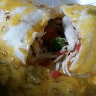 Chicken Fajita burrito, smothered in green, and super pretty inside.