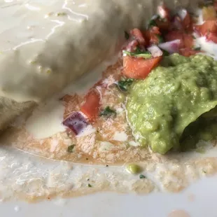 California burrito swimming in watery sauce.