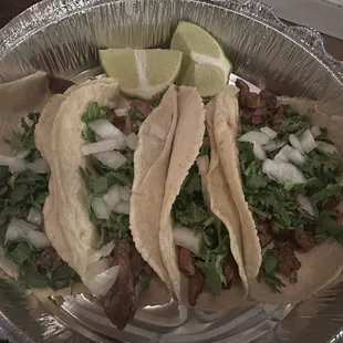 Tacos. Wish I knew which was what. They are one of each of: Diabla, Pastor de puerco, Carnitas, &amp; Carne asada! Very good!