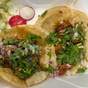 Street tacos. Carnitas on the left and pastor on the right. Pastor was my favorite!